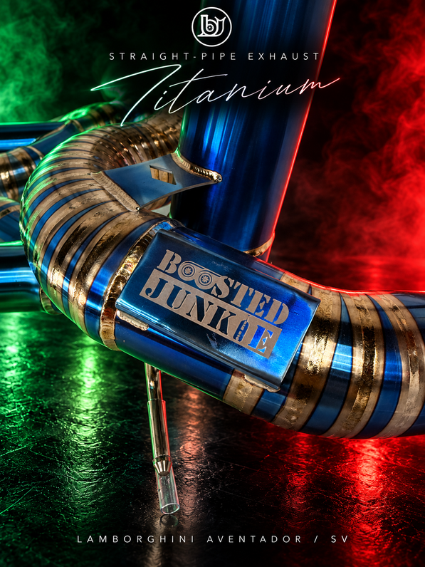 Close-up of the BJG blue titanium straight-pipe exhaust for Lamborghini Aventador / LP750-4 SV, showing the engraved plaque, pie-cut welds and mounting bracket with green and red lighting.