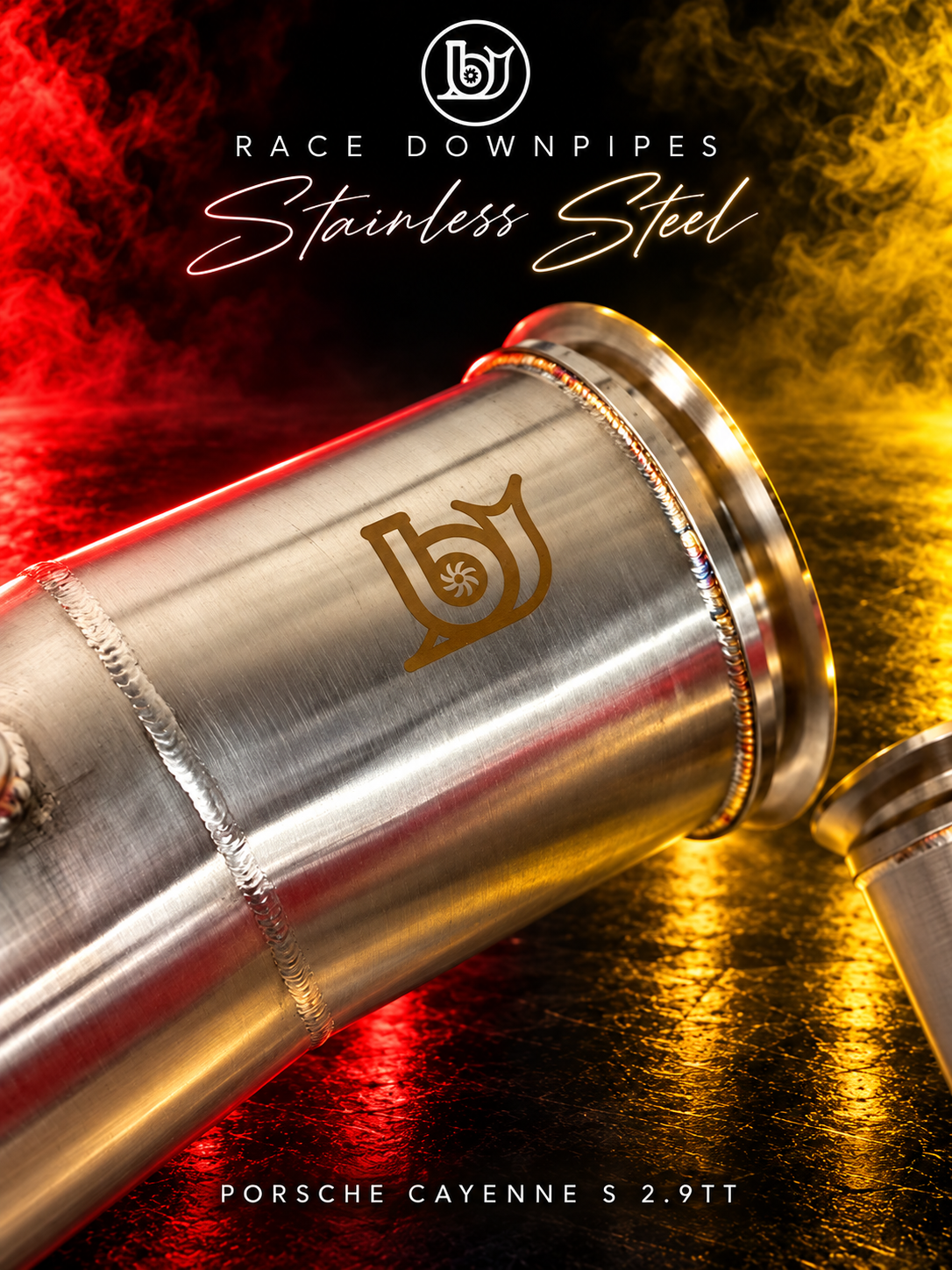 Close-up of the BJG logo, stainless heat shield, welds and flange on a Porsche Cayenne S 2.9TT race downpipe, with red and yellow lighting.