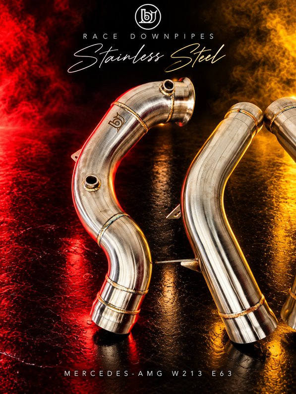 Bare stainless W213 E63 race downpipe and connecting section detail, showing sensor ports, welds and mounting brackets.